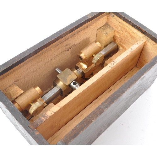 392 - An early 20th Century watchmakers lathe and accessories in original box. Measuring approximately 18c... 