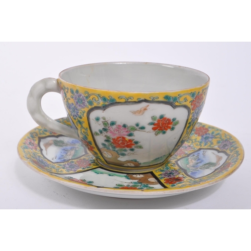 394 - An early 20th century circa 1920s Japanese porcelain china cup and saucer. Chinoiserie yellow famill... 