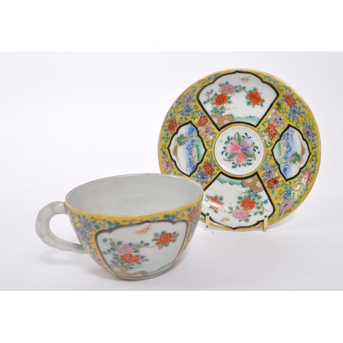 394 - An early 20th century circa 1920s Japanese porcelain china cup and saucer. Chinoiserie yellow famill... 