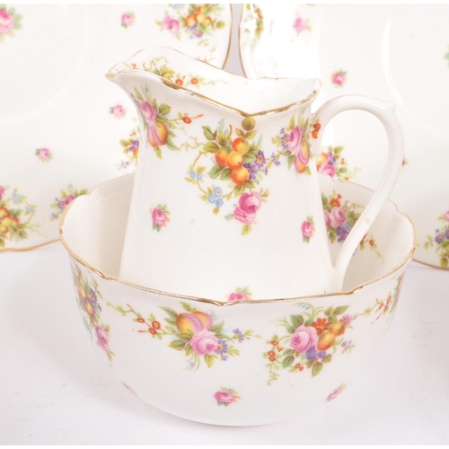 395 - Royal Doulton - An early 20th Century china porcelain tea service in a floral / fruit pattern, compr... 