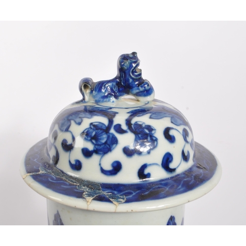 398 - A Chinese 19th century blue and white Qing dynasty table vase. With floral and foliate design to tap... 