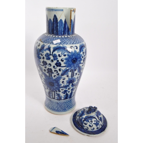 398 - A Chinese 19th century blue and white Qing dynasty table vase. With floral and foliate design to tap... 