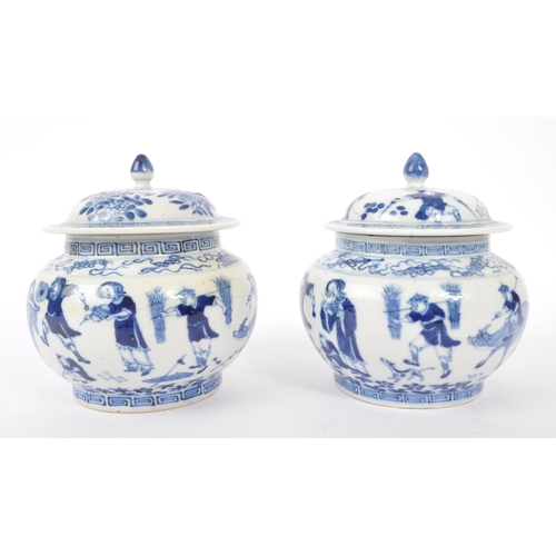 40 - A pair of early 19th Century Qing dynasty Chinese porcelain blue and white lidded pots of squat bulb... 