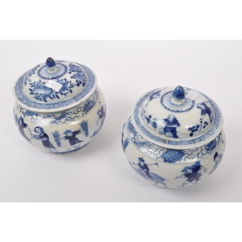 40 - A pair of early 19th Century Qing dynasty Chinese porcelain blue and white lidded pots of squat bulb... 