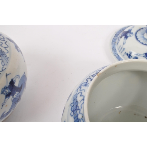 40 - A pair of early 19th Century Qing dynasty Chinese porcelain blue and white lidded pots of squat bulb... 