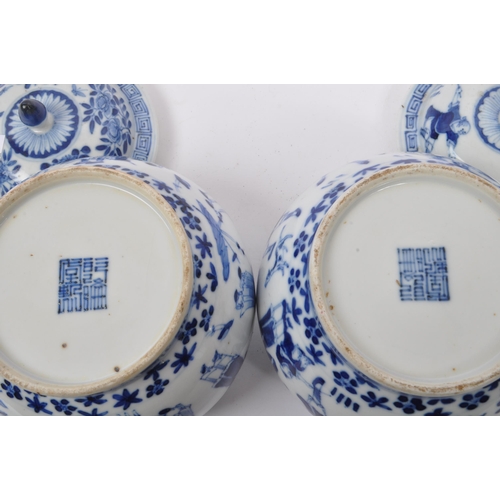 40 - A pair of early 19th Century Qing dynasty Chinese porcelain blue and white lidded pots of squat bulb... 