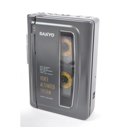 404 - Sanyo / Aiwa - A collection of three cassette players to include Sanyo M1118 standard compact casset... 