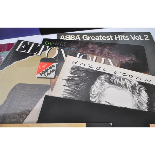 414 - A collection of 20th century LP vinyl records to include Bee Gees E.S,.P, The Beach Boys, Bryan Adam... 