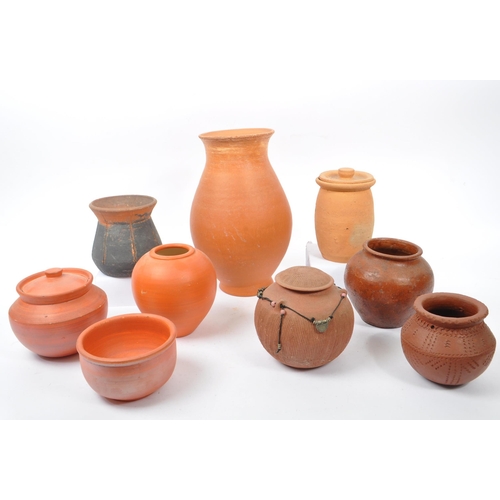 42 - A collection of 20th century believed North African, red slip ware manner terracotta pottery. The co... 