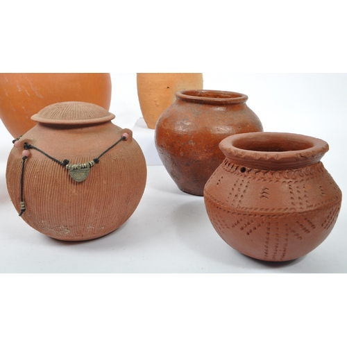 42 - A collection of 20th century believed North African, red slip ware manner terracotta pottery. The co... 