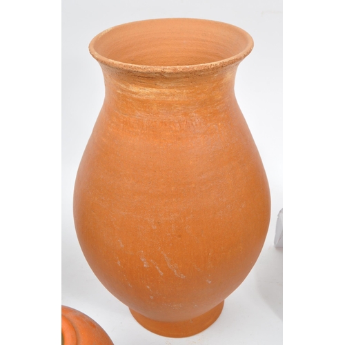 42 - A collection of 20th century believed North African, red slip ware manner terracotta pottery. The co... 