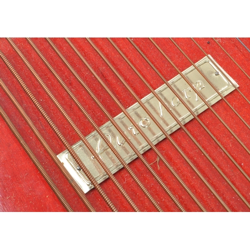 427 - A 20th Century vintage nine chord bar autoharp in red and black with picture of scale to bottom. In ... 