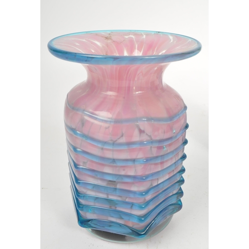 43 - Mdina - A collection of three Mdina glass trailed maltese vases comprising of a pink glass vase and ... 