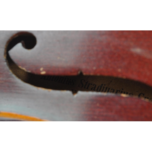 436 - An early 20th Century two piece back full size 4/4 violin musical instrument having ebonised fingerb... 