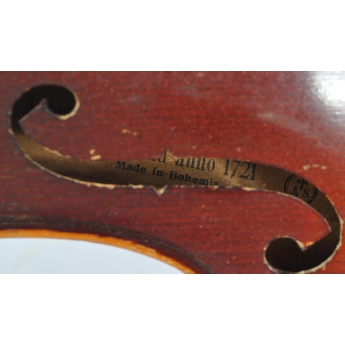 436 - An early 20th Century two piece back full size 4/4 violin musical instrument having ebonised fingerb... 