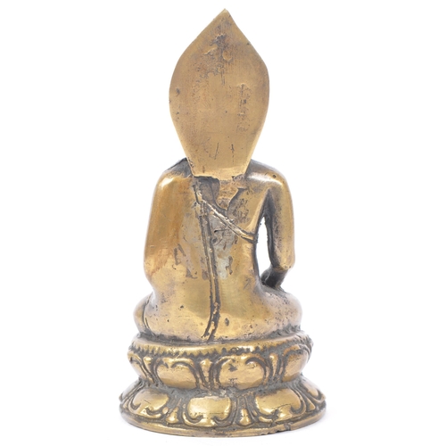 437 - Early 20th century brass Tibetan religious Buddha. Seating in the medicine pose on an oval base. Mea... 