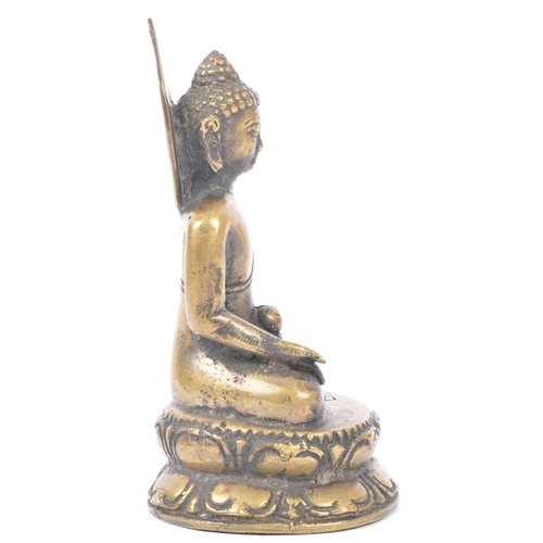 437 - Early 20th century brass Tibetan religious Buddha. Seating in the medicine pose on an oval base. Mea... 