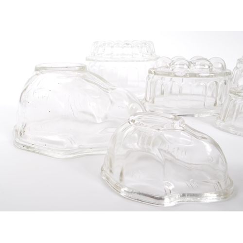 468 - A collection of vintage glass Jelly moulds. Large and small Rabbit shape, small to large graduated s... 