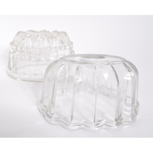 468 - A collection of vintage glass Jelly moulds. Large and small Rabbit shape, small to large graduated s... 