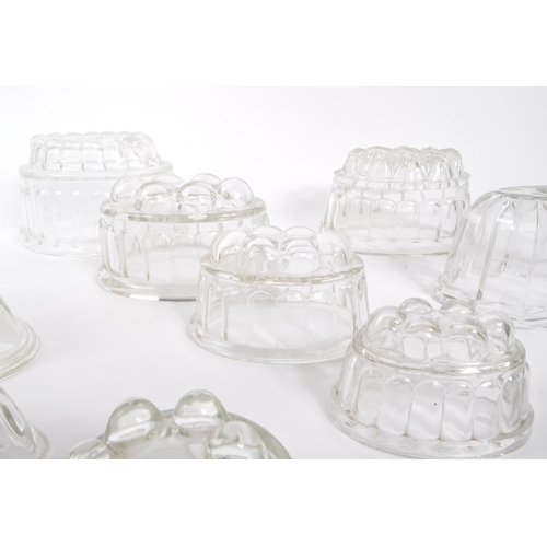 468 - A collection of vintage glass Jelly moulds. Large and small Rabbit shape, small to large graduated s... 