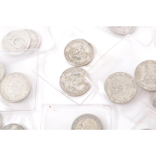 485 - A collection of approximately 48 British pre-1947 1920s, 1930s, 1940s one shilling coins. Mixed silv... 