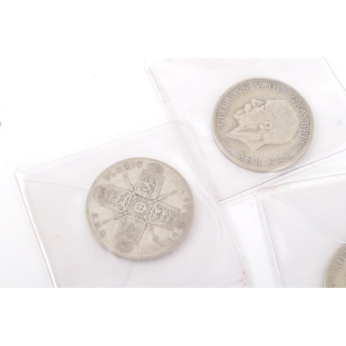 490 - A collection of approximately twenty one 1920s & 1930s British one florin coins. Mixed 925 silver co... 