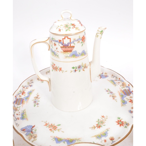 50 - Royal Worcester - An English porcelain china George V tea / coffee set circa 1922 to include cups, s... 