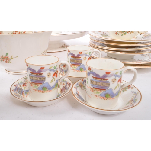 50 - Royal Worcester - An English porcelain china George V tea / coffee set circa 1922 to include cups, s... 