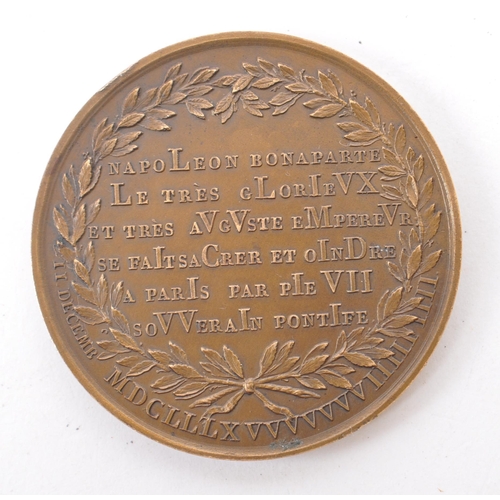 500 - A 20th century French bronze Napoleon coronation medal / coin. The coin commemorating Napoleon's 180... 