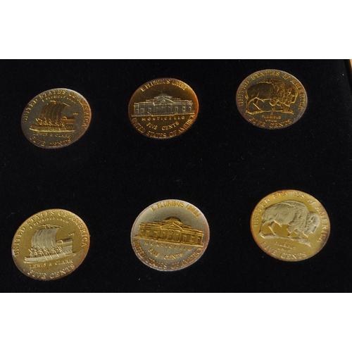 529 - A collection of ten gold and silver highlighted American ( United States of America ) New U.S Five C... 