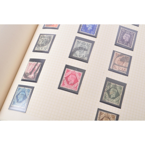 546 - A collection of 19th and 20th century British postal stamps. The stamps housed in a single stamp alb... 