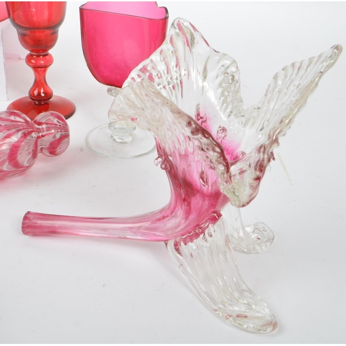 57 - A collection of Victorian 19th century cranberry cut glass. To include two sugar sifters, hand bell,... 