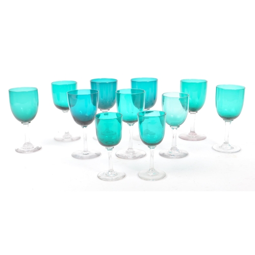 59 - A collection of eleven turquoise stemmed drinking / display glasses. Of various sized with coloured ... 