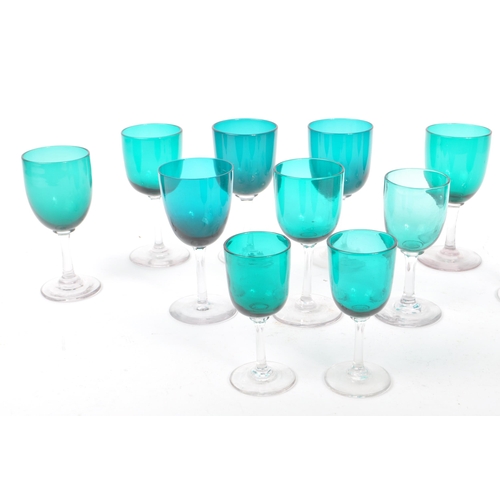 59 - A collection of eleven turquoise stemmed drinking / display glasses. Of various sized with coloured ... 