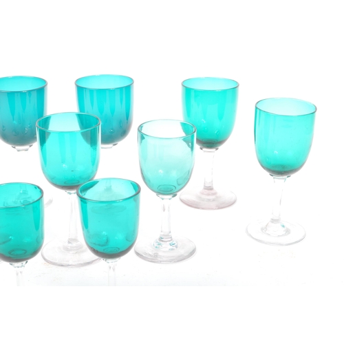 59 - A collection of eleven turquoise stemmed drinking / display glasses. Of various sized with coloured ... 