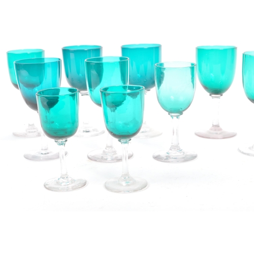 59 - A collection of eleven turquoise stemmed drinking / display glasses. Of various sized with coloured ... 