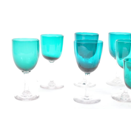 59 - A collection of eleven turquoise stemmed drinking / display glasses. Of various sized with coloured ... 