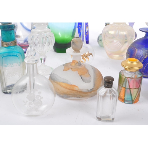 66 - A collection of early and mid 20th century studio art glass perfume bottles. The collection to inclu... 