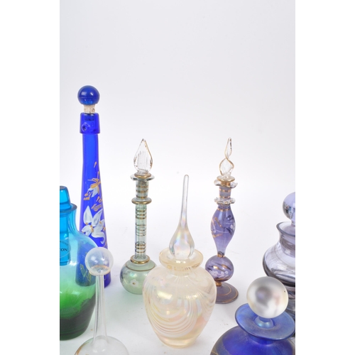 66 - A collection of early and mid 20th century studio art glass perfume bottles. The collection to inclu... 