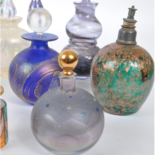 66 - A collection of early and mid 20th century studio art glass perfume bottles. The collection to inclu... 