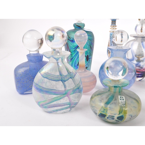 66 - A collection of early and mid 20th century studio art glass perfume bottles. The collection to inclu... 