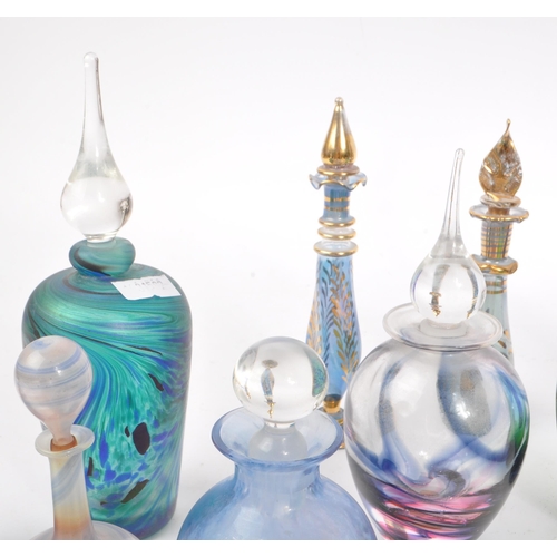 66 - A collection of early and mid 20th century studio art glass perfume bottles. The collection to inclu... 