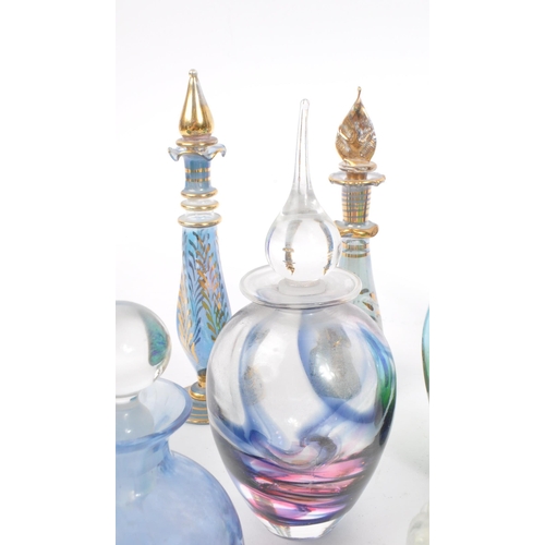 66 - A collection of early and mid 20th century studio art glass perfume bottles. The collection to inclu... 