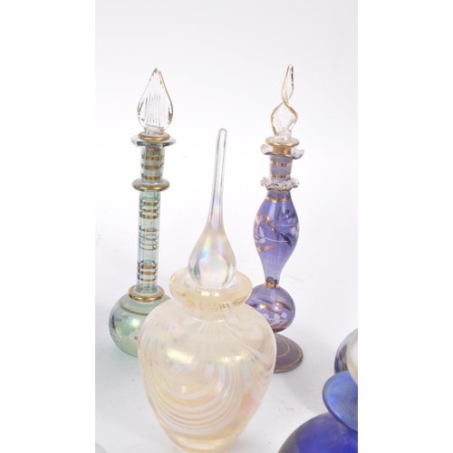 66 - A collection of early and mid 20th century studio art glass perfume bottles. The collection to inclu... 