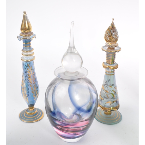 66 - A collection of early and mid 20th century studio art glass perfume bottles. The collection to inclu... 