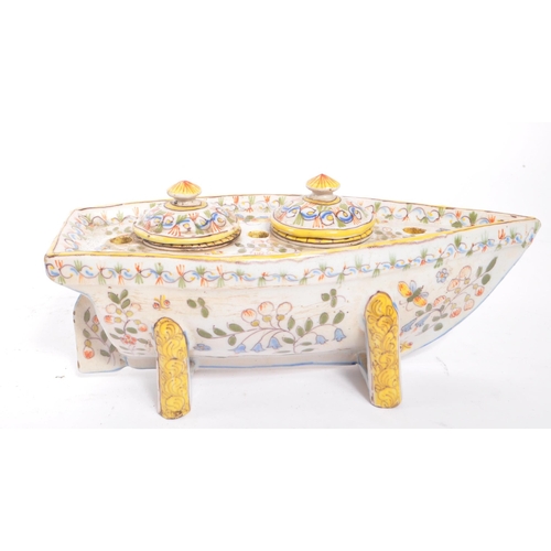 7 - A 18th Century French Faience ink pot stand. In the form of a boat and ceramic construction. With ha... 