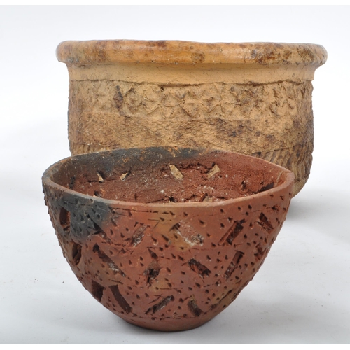 70 - A collection of terracotta / clay tribal folk art pots. The collection to include a large rounded po... 