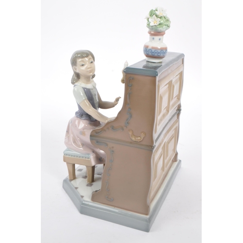 9 - Lladro - A 20th Century vintage china porcelain Lladro figurine ' Practice Makes Perfect ' in the fo... 