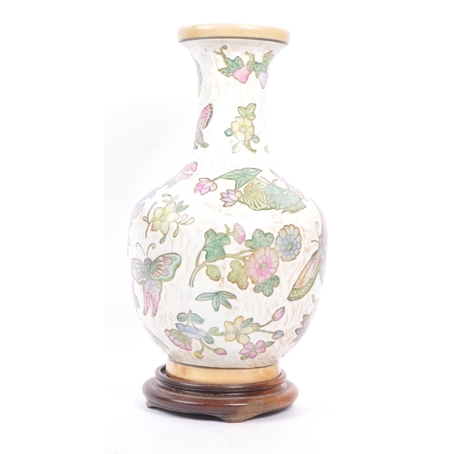 95 - A 20th century Chinese porcelain baluster vase. The vase having white ground and being hand painted ... 