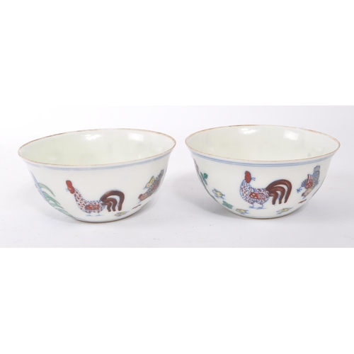 98 - A pair of early 20th Century Chinese porcelain tea bowls having hand painted motif of rooster / chic... 